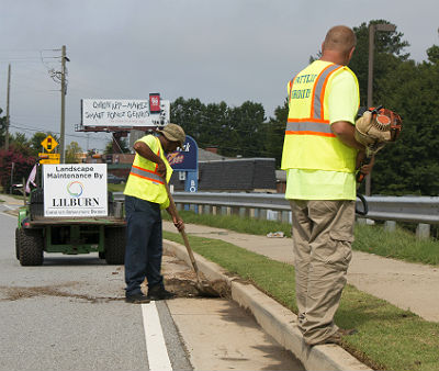 Landscaping and cleanup in the Lilburn CID